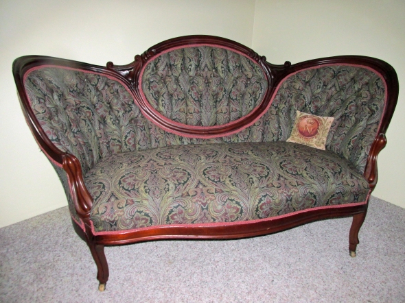 50 cents bought this sofa long ago. Renovating it took a bit more.  Still, there is a smudge on the photo, could be a ghost?